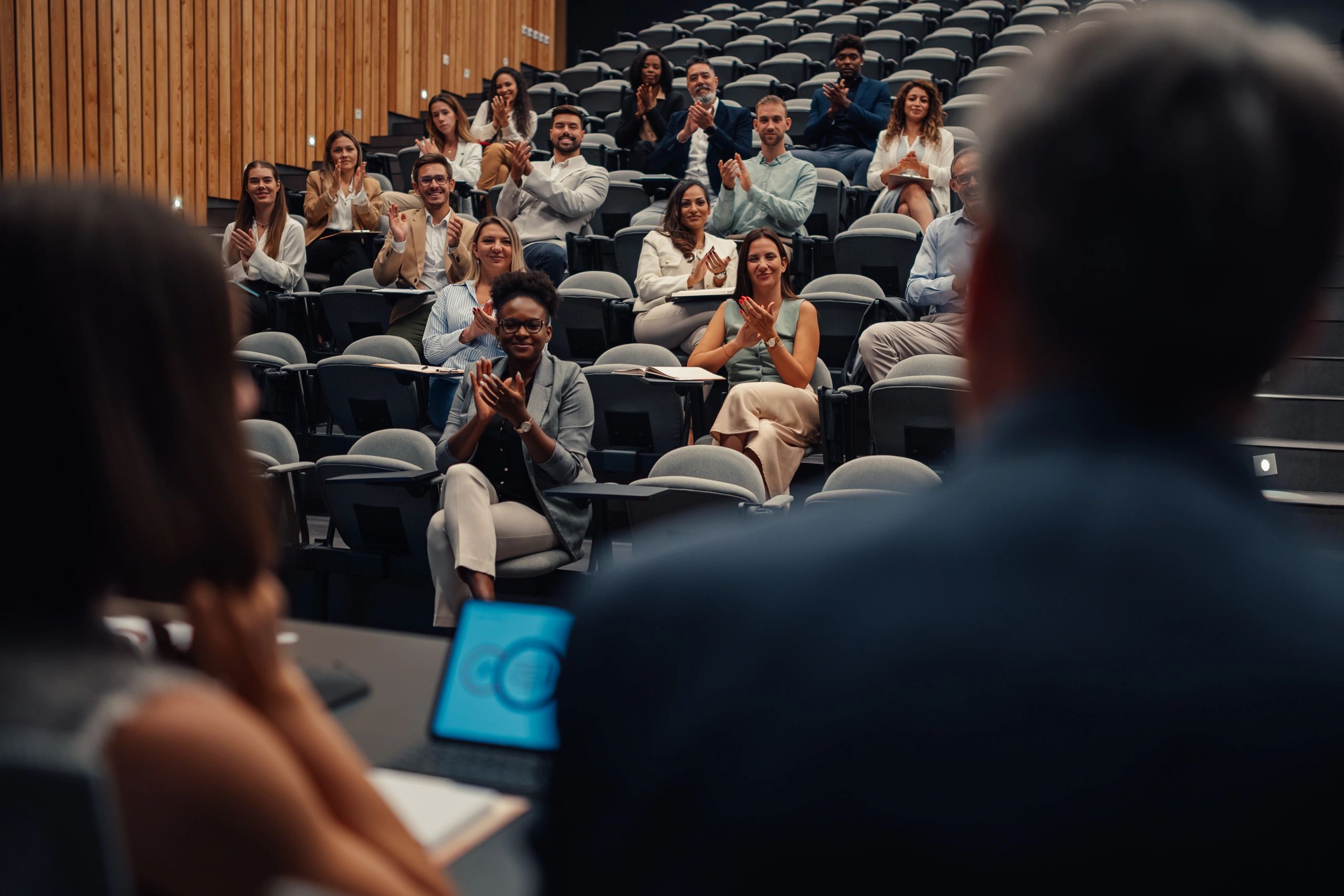 Conference audience applauding a presentation